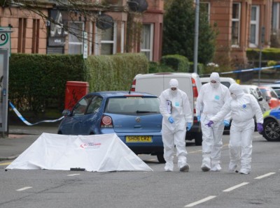 Police on Minard Road, Shawlands, Glasgow, investigating the death of popular shop keeper Asad Shah following an incident at his shop. March 25, 2016. See SWNS story SWMUSLIM; A popular Muslim shopkeeper has been stabbed to death in the street - just four hours after wishing "a very happy Easter to my beloved Christian nation". Peace-loving Asad Shah, 40, was set upon with a knife and had his head stamped on in a shocking attack outside his Glasgow newsagents shop just after 9pm last night (Thurs). The appalling attack came just hours after deeply religious Mr Shah, who was keen to reach out from the Muslim community to Christian neighbours, posted heartfelt Easter messages on social media. And the messages revealed that he was today (Friday) due to be hosting a Google hangout with Christian friends about the importance of Easter.