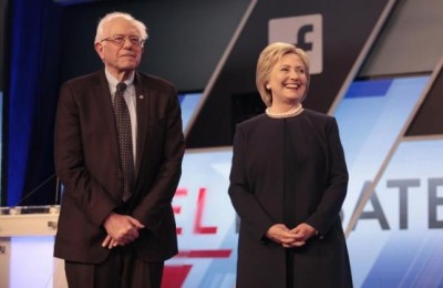 Democratic U.S. presidential candidates Senator Bernie Sanders and Hillary Clinton pose before the start of the Univision News and Washington Post Democratic U.S. presidential candidates debate in Kendall, Florida March 9, 2016.  REUTERS/Javier Galeano