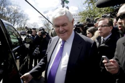 Former Speaker of the House Newt Gingrich is followed by the media as he walks from a meeting with Republican presidential candidate Donald Trump in Washington, March 21, 2016.      REUTERS/Joshua Roberts